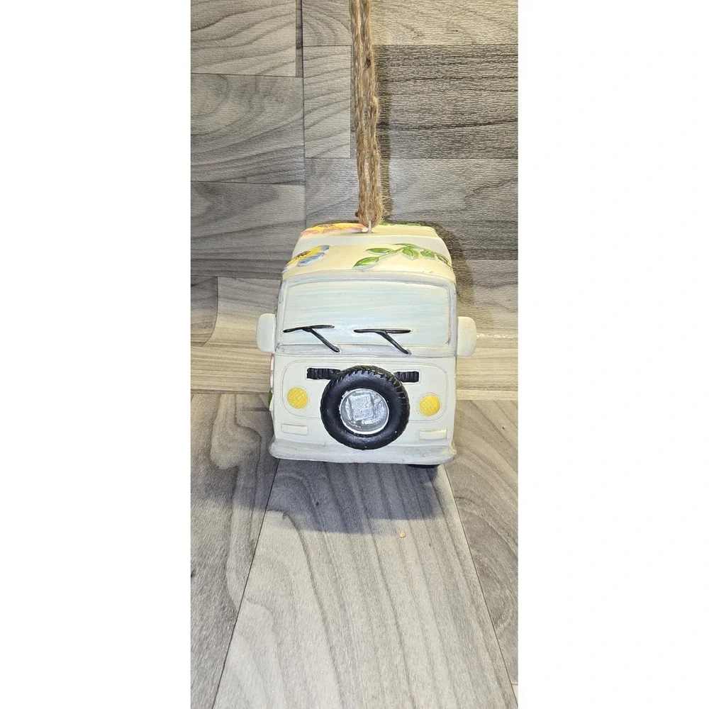 decorative birdhouse styled like a vintage camper van